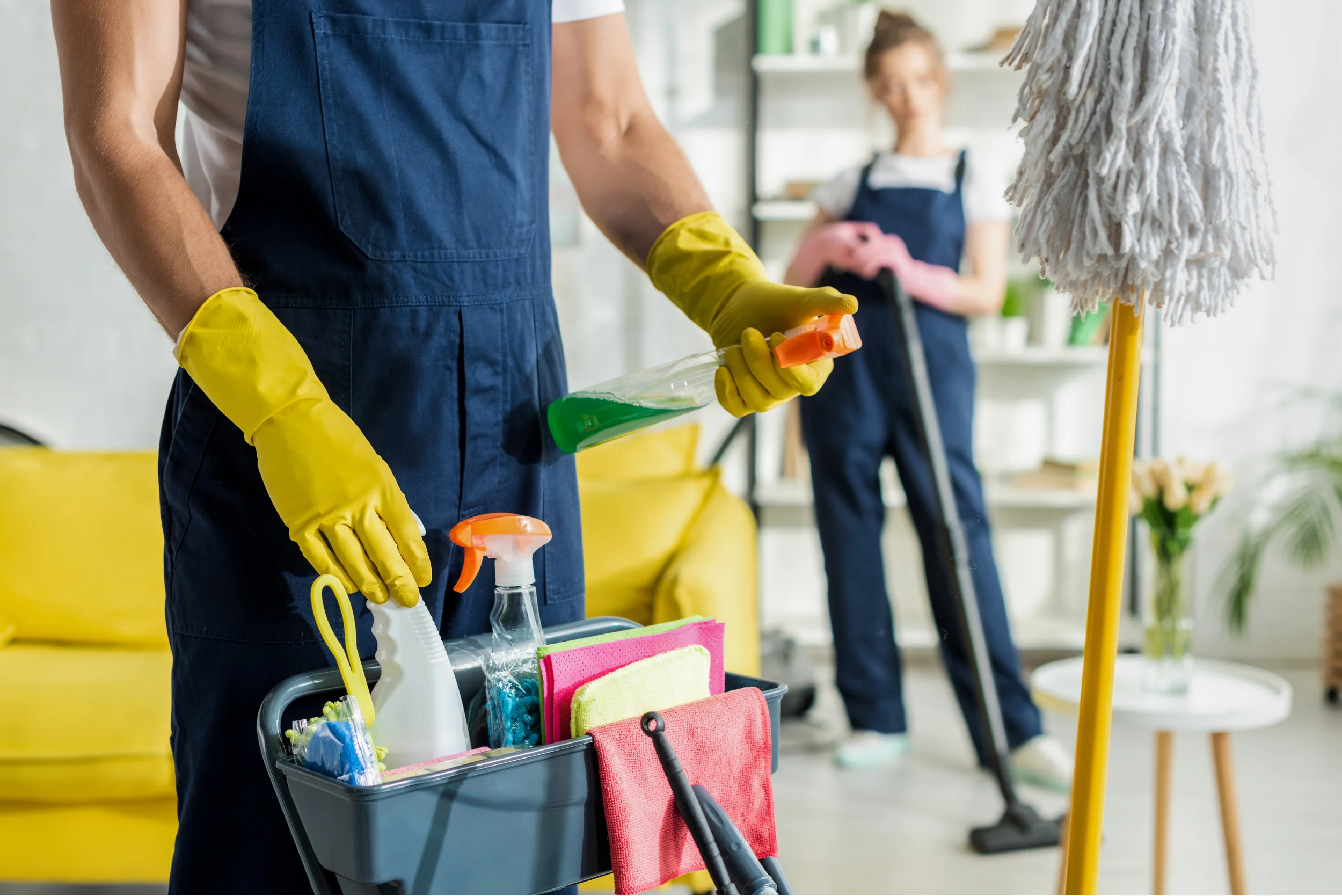 Two people in overalls and cleaning supplies. Star Clean Ltd, Cleaning, Cleaners, Commercial Cleaners, Domestic Cleaners. Bath, Bristol